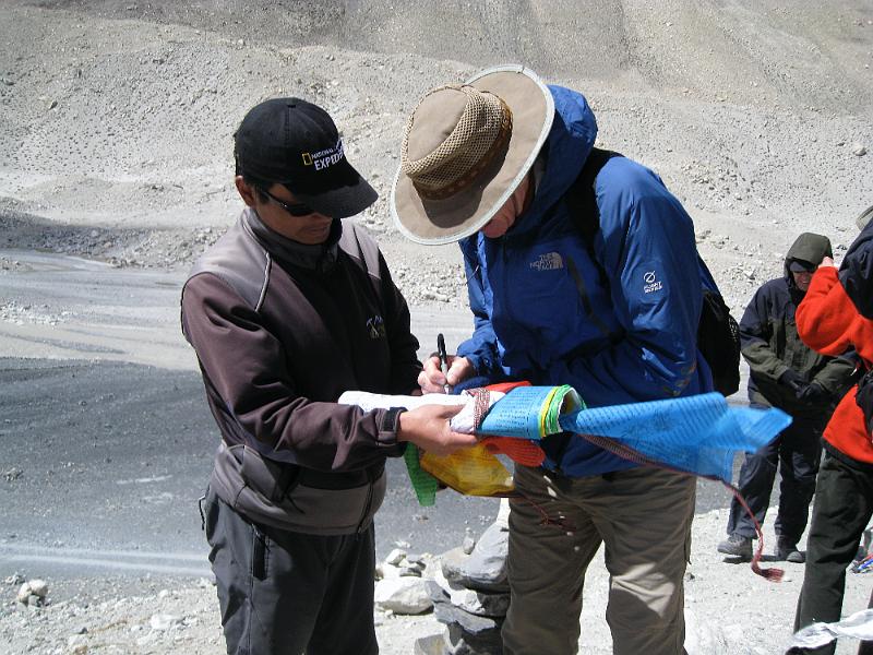 IMG_0714.JPG - PETER SIGNS PRAYER FLAGS - EVEREST BASE CAMP